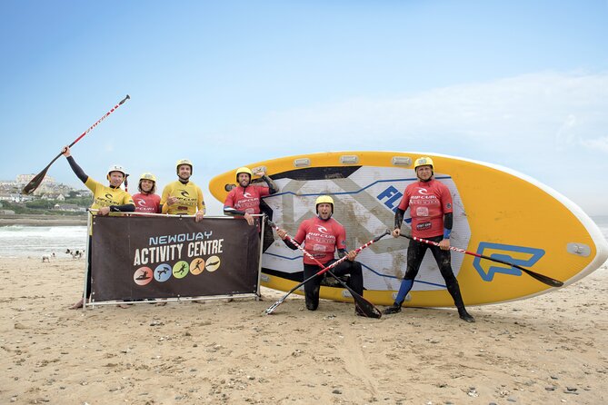 Giant Stand Up Paddle Boarding Experience in Newquay - Paddling as a team on open water