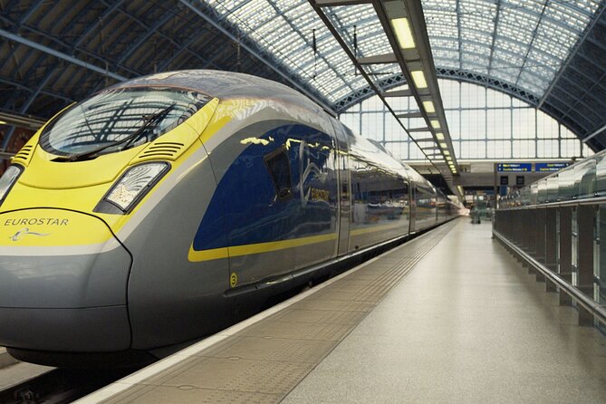 Paris by Rail - Sightseeing Bus and Eiffel Tower Champagne Lunch - Passing the Arc de Triomphe and Champs-Élysées