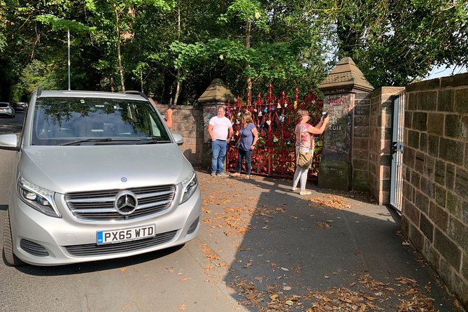 Private Beatles Car Tour, Penny Lane, Strawberry Field & childhood homes - Starting with the Beatles statues at the Pier Head
