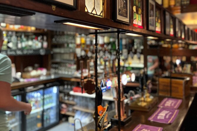 Royal Historic Pubs Walking Guided Tour in London - A closer look at the opening near Piccadilly Circus